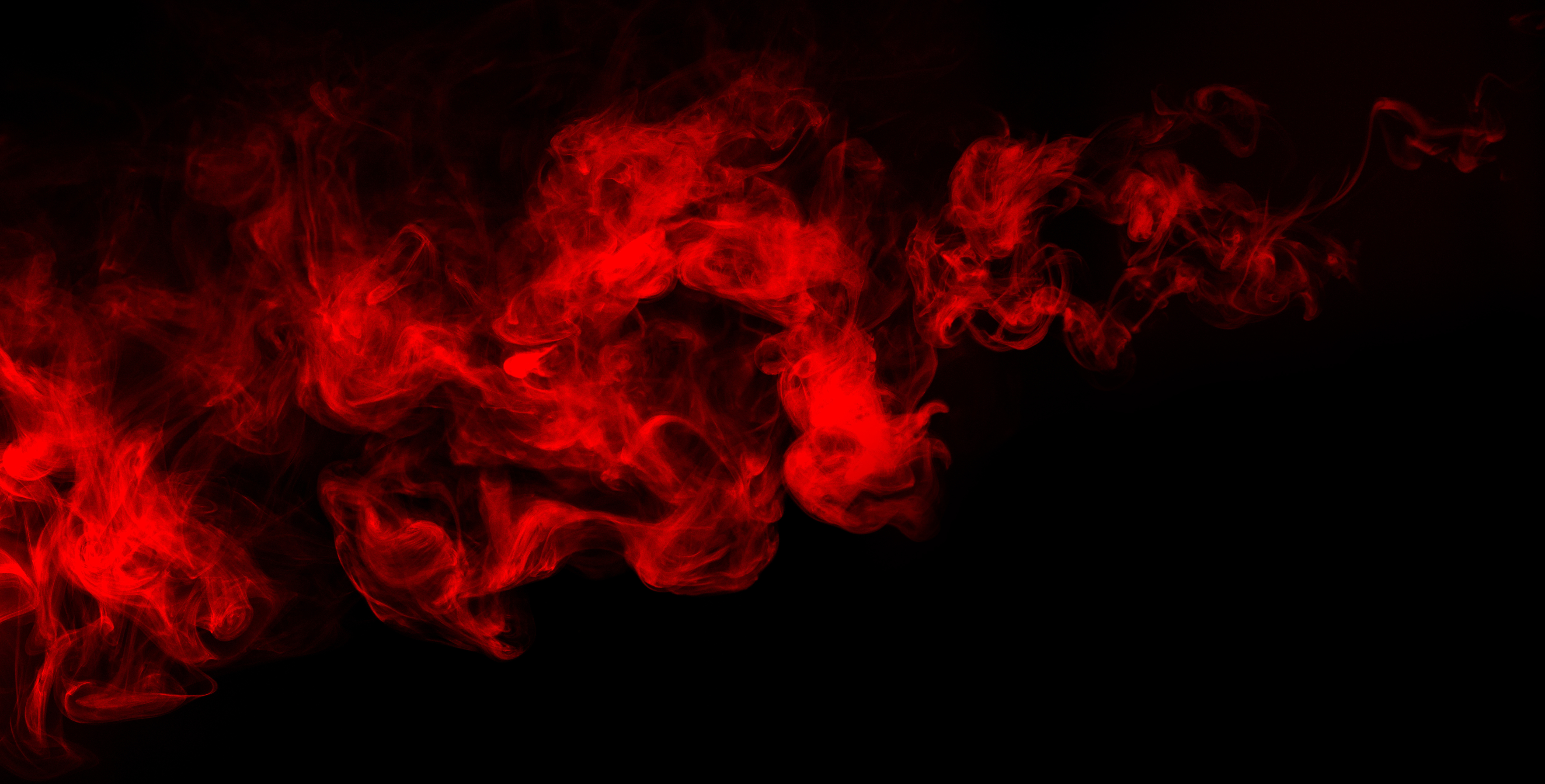 red smoke at dark background